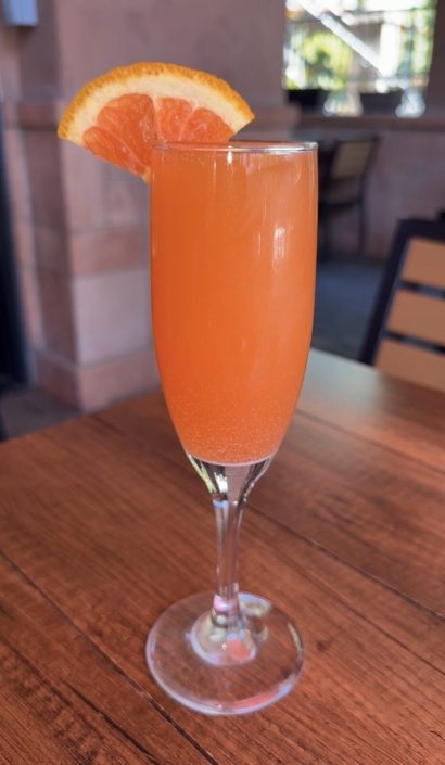 Mimosa garnished with an orange slice