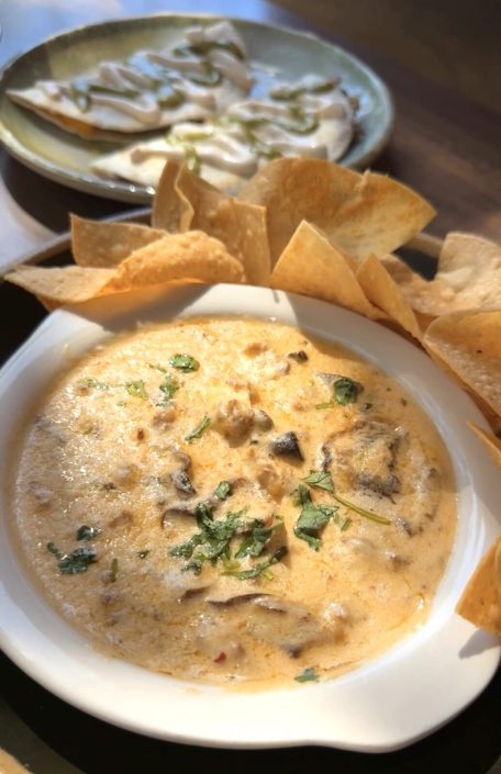 Melted cheese dip with tortilla chips